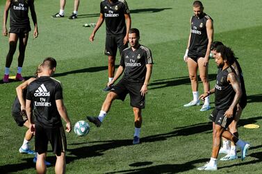 epa07775894 Real Madrid's Belgian forward Eden Hazard (C) controls the ball in the middle of his teammates Marcelo Vieira (R), Karim Benzema (3-R), among others, during a team's training session at club's sport complex in Valdebebas, Madrid, Spain, 16 August 2019. Real madrid will face Celta Vigo on 17 August in their first LaLiga season 2019/2020 soccer match. EPA/JUAN CARLOS HIDALGO