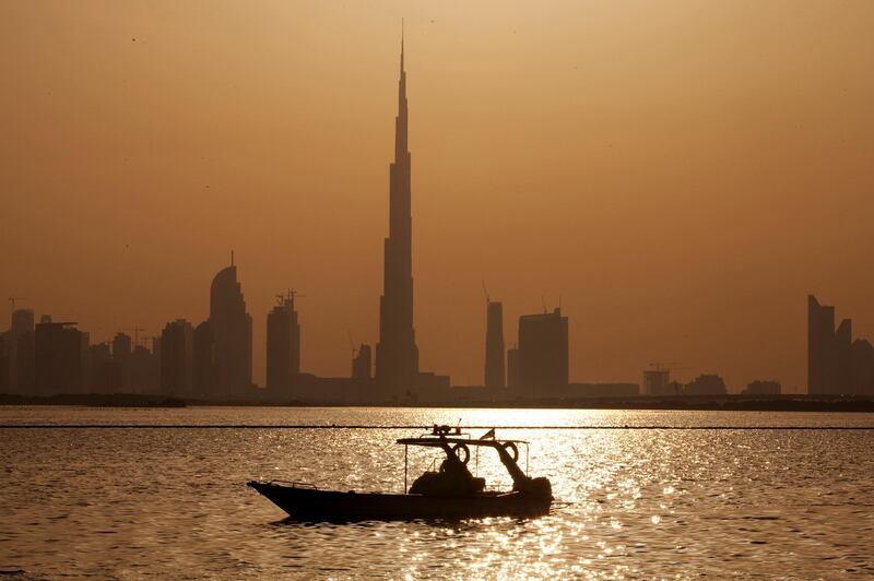 A coast guard boat patros the waters of the Ras Al Khor nature reserve with a view of the Burj Khalifa and downtown in Dubai on April 9, 2012. Christopher Pike / The National
