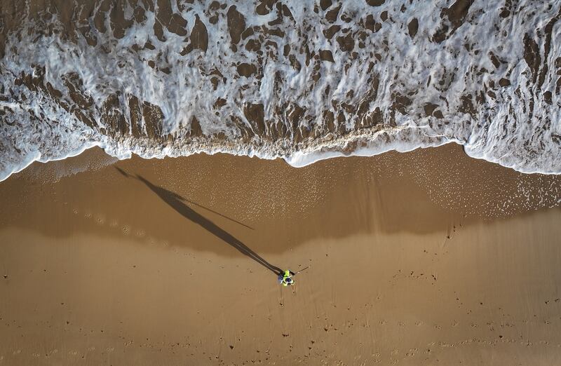 A land surveyor measures beach and sand erosion using GPS on Hemsby Beach in Hemsby, England. Getty Images