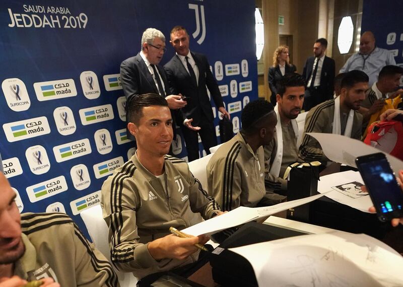 Cristiano Ronaldo signing autographs in Jeddah. Getty Images