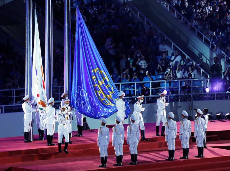 Guards prepare to hoist flags during the 31st Southeast Asian Games opening ceremony at the My Dinh National Stadium in Hanoi, Vietnam. EPA
