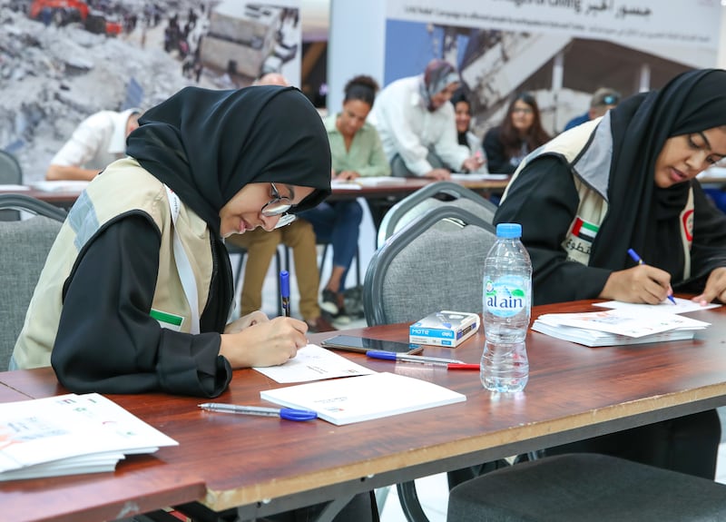 A volunteer writing letters of comfort