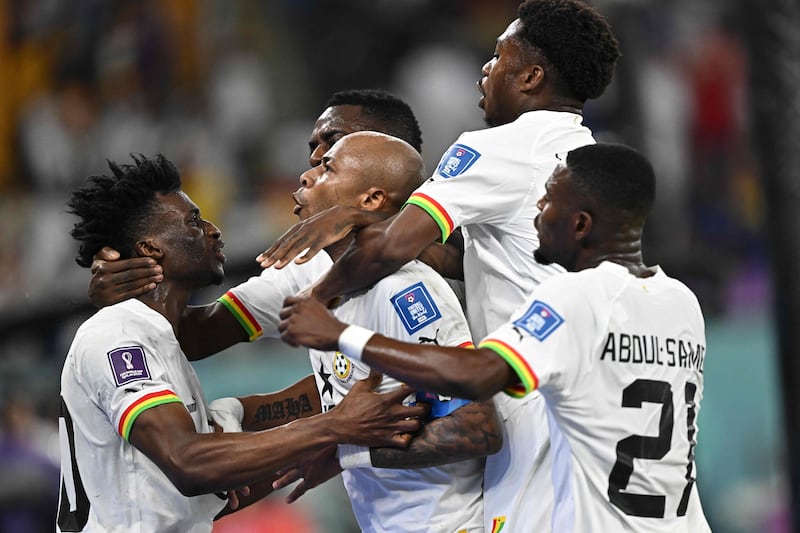 Ghana's midfielder Andre Ayew celebrates with teammates after levelling at 1-1. AFP