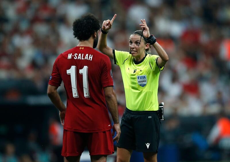 Referee Stephanie Frappart of France gestures as she speaks to Liverpool's Mohamed Salah. AP Photo