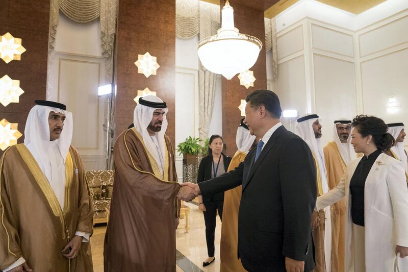 ABU DHABI, UNITED ARAB EMIRATES - July 19, 2018: HE Mohamed Abdulla Al Gergawi, UAE Minister of Cabinet Affairs and the Future (2nd L) greets HE Xi Jinping, President of China (R), during a reception held at the Presidential Airport. Seen with HE Ahmed Juma Al Zaabi, UAE Deputy Minister of Presidential Affairs (L) and and Peng Liyuan, First Lady of China (back R).

( Mohamed Al Hammadi / Crown Prince Court - Abu Dhabi )
---