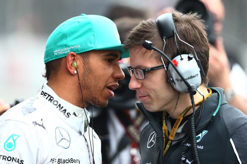 Lewis Hamilton, left, will get less information from his Mercedes-GP race engineer Pete Bonnington from now on in races. Clive Mason / Getty Images