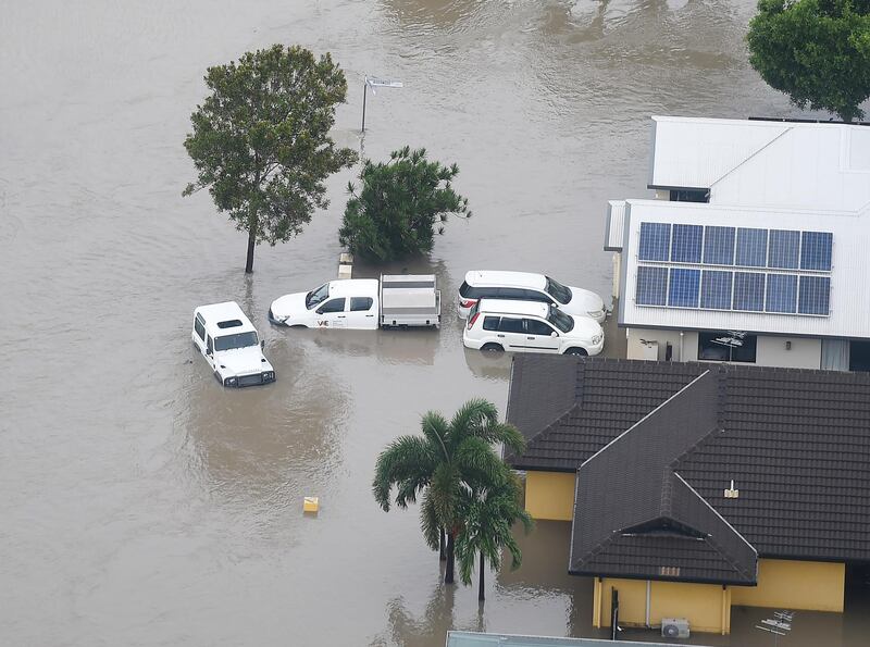 Partially submerged cars are seen in Townsville. Getty Images