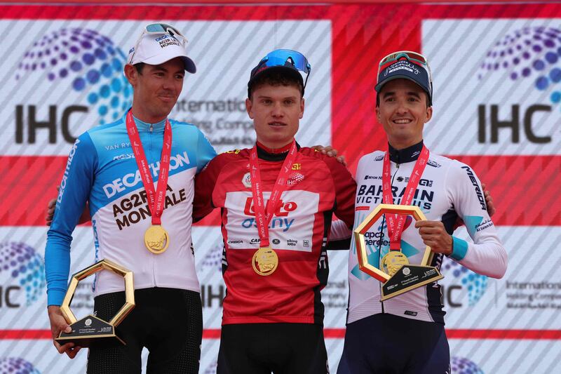 Stage 7 winner Lennert Van Eetvelt, centre, with Pello Bilbao, right, who finished second, and Ben O'Connor, who was third. AFP