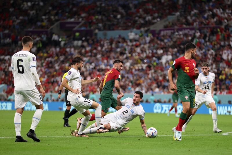 Jose Gimenez of Uruguay touches the ball with his hand as he tries to make a block. The referee awarded a penalty to Portugal. Getty