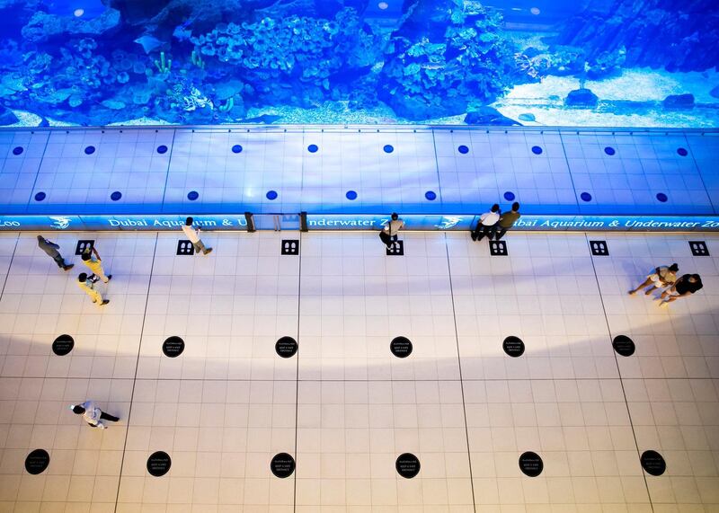 DUBAI, UNITED ARAB EMIRATES. 11 JUNE 2020. 
Signs requiring people to social distance at Dubai Mall’s Dubai Aquarium and Underwater Zoo
(Photo: Reem Mohammed/The National)

Reporter:
Section: