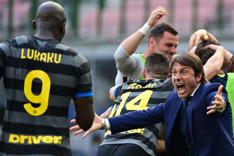 Inter Milan coach Antonio Conte celebrates with Romelu Lukaku after Inter's 1-0 win over Hellas Verona. AFP
