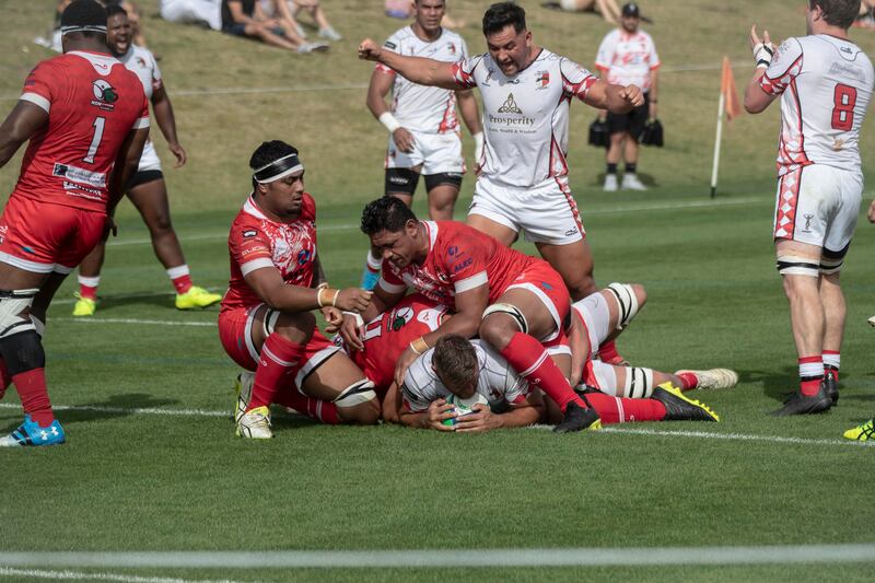 Action from the UAE Premiership game between Abu Dhabi Harlequins (in white) and Dubai Tigers