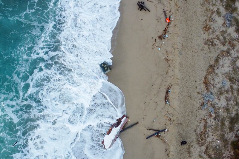 Pieces of the boat on the shore near Cutro. AP