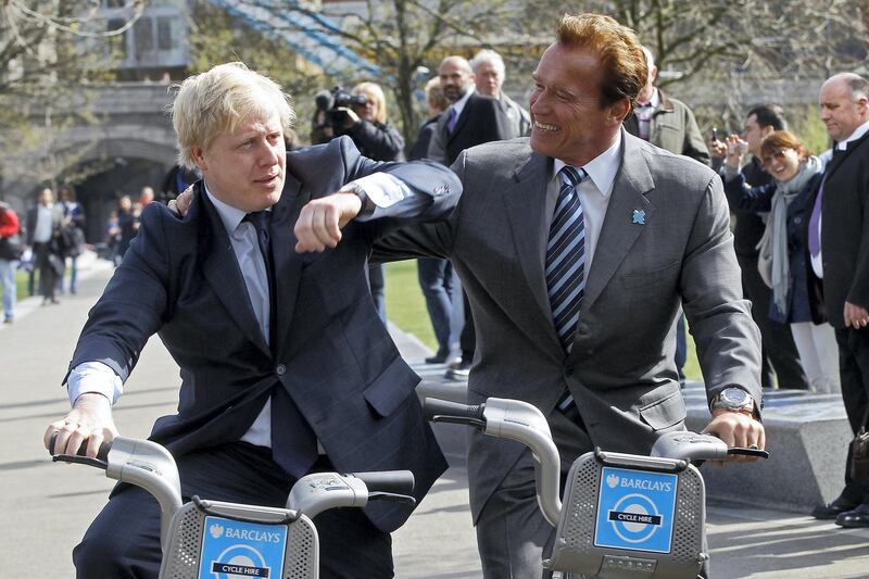 Former California Governor, Arnold Schwarzenegger (R), and London Mayor Boris Johnson  pose for photographers, in London March 31, 2011.    REUTERS/Stefan Wermuth (BRITAIN - Tags: ENTERTAINMENT POLITICS)