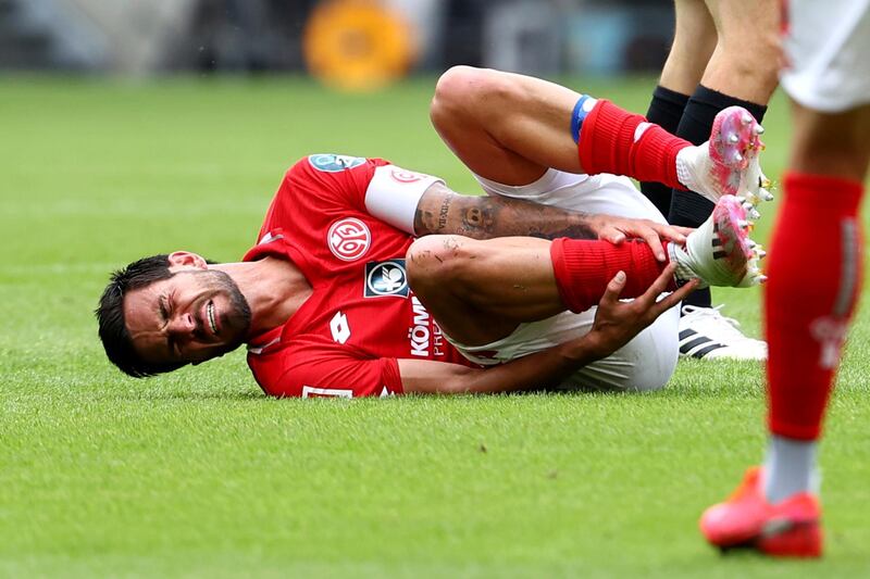 Danny Latza from Mainz after picking up an injury against Augsburg. AP