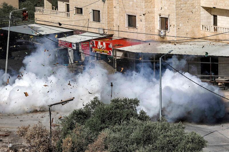 Smoke erupts from the detonation of an explosive charge left by Palestinians in Jenin during the Israeli army raid. AFP