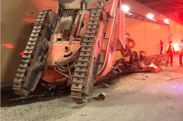 The digger was mounted on a flatbed truck that crashed into the tunnel's low ceiling. Courtesy: Dubai Police