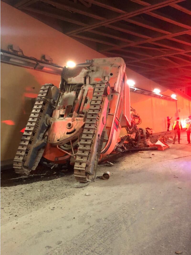The digger was mounted on a flatbed truck that crashed into the tunnel's low ceiling. Courtesy: Dubai Police
