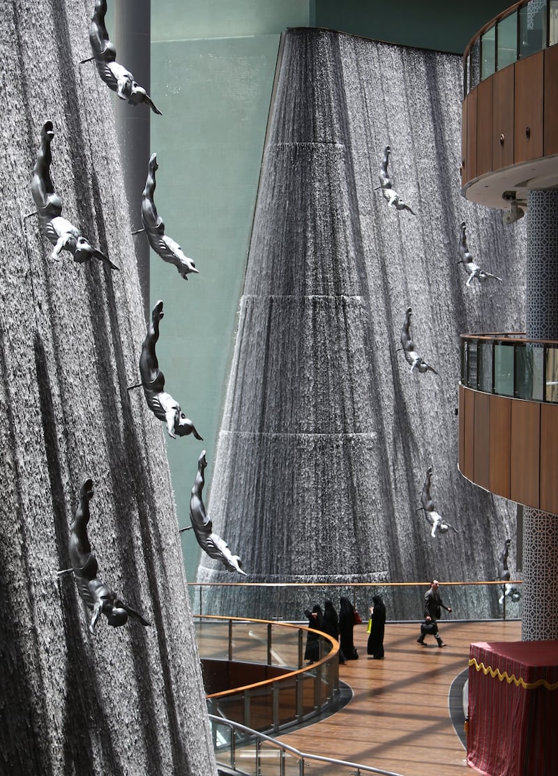 The fountain with sculpture divers at Dubai Mall is a popular site in the shopping centre. AFP