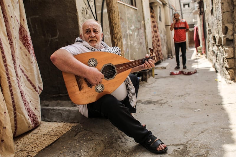 Tawfiq Shanaa, a 66-year-old man, plays the oud as he performs traditional Palestinian songs outside his house in the Rafah camp for Palestinian refugees in the southern Gaza Strip.  June 20 marks World Refugee Day, a day dedicated by the United Nations General Assembly to raising awareness of the situation of refugees throughout the world. Some five million individuals are refugees registered with the UN Relief and Works Agency for Palestine Refugees (UNRWA), of whom more than 1.5 million (nearly one-third) live in 58 recognised refugee camps in the Gaza Strip and the West Bank including East Jerusalem, in addition to Jordan, Lebanon, and Syria. Palestine refugees are defined by the UNRWA as "persons whose normal place of residence was Palestine during the period 1 June 1946 to 15 May 1948, and who lost both home and means of livelihood as a result of the 1948 conflict." AFP