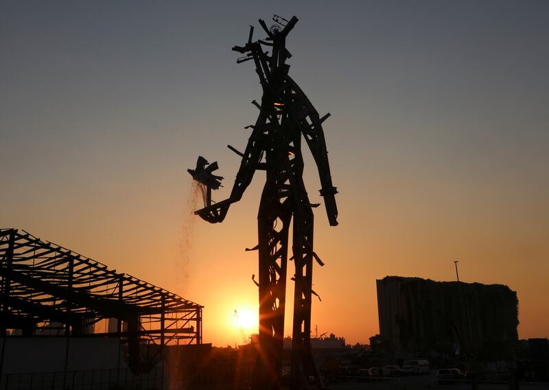 Sunset view of 'The Gesture', a 25-metre sculpture by Lebanese architect Nadim Karam, to commemorate the victims of last year's Beirut blast. Reuters