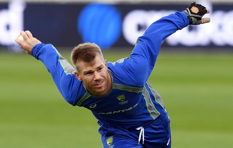 David Warner and his fellow Australia cricketers are holding out for what they term a fair share of the revenue earned by Cricket Australia. Paul Ellis / AFP
