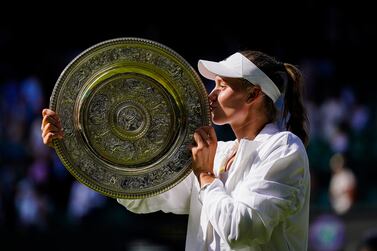 Elena Rybakina celebrates with the The Venus Rosewater Dish following victory over Ons Jabeur in The Final of the Ladies' Singles on day thirteen of the 2022 Wimbledon Championships at the All England Lawn Tennis and Croquet Club, Wimbledon. Picture date: Saturday July 9, 2022.