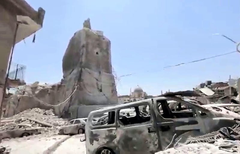 An image grab taken from a video relesead online by the Islamic state group's Amaq propaganda agency on June 23, 2017 shows Mosul's trademark leaning minaret  destroyed after jihadists blew it up, according to officials from Iraq and the US-led anti-IS coalition, as Iraqi forces advanced on an ancient mosque compound in the embattled northern city. - Mosul's trademark leaning minaret was missing from its skyline for the first time in centuries after desperate jihadists blew it up as Iraqi forces advanced on an ancient mosque compound in the embattled northern city. Explosions on June 21 evening levelled both the Nuri mosque where Abu Bakr al-Baghdadi gave his first sermon as leader of the Islamic State group and its ancient leaning minaret, known as the "Hadba" (Hunchback). (Photo by Handout / various sources / AFP) / RESTRICTED TO EDITORIAL USE - MANDATORY CREDIT "AFP PHOTO / HO / AAMAQ NEWS AGENCY" - NO MARKETING NO ADVERTISING CAMPAIGNS - DISTRIBUTED AS A SERVICE TO CLIENTS FROM ALTERNATIVE SOURCES, AFP IS NOT RESPONSIBLE FOR ANY DIGITAL ALTERATIONS TO THE PICTURE'S EDITORIAL CONTENT, DATE AND LOCATION WHICH CANNOT BE INDEPENDENTLY VERIFIE / 