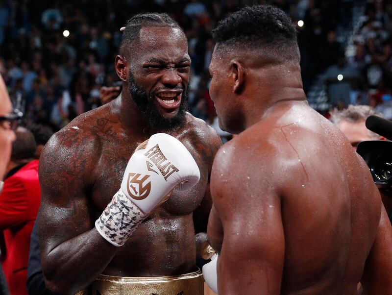 Deontay Wilder, left, talks with Luis Ortiz after their WBC heavyweight title fight in Las Vegas. AP