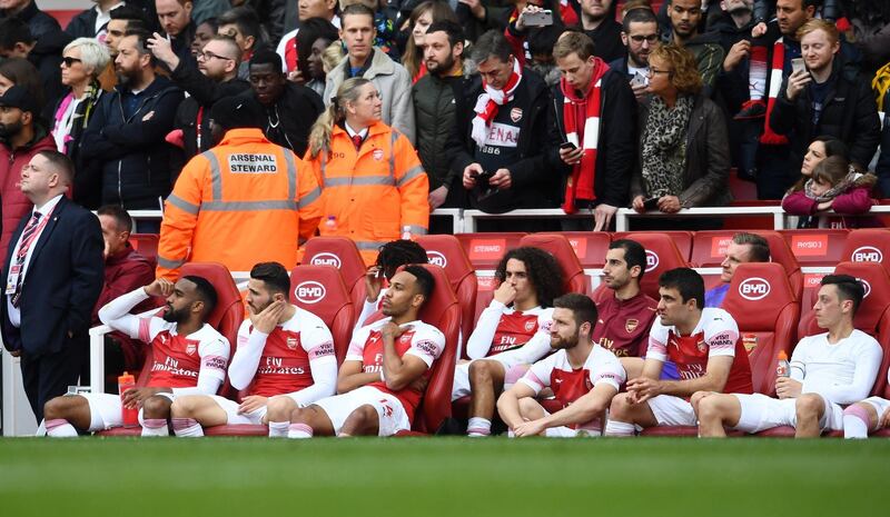 Arsenal's players cannot hide their dejection. Getty
