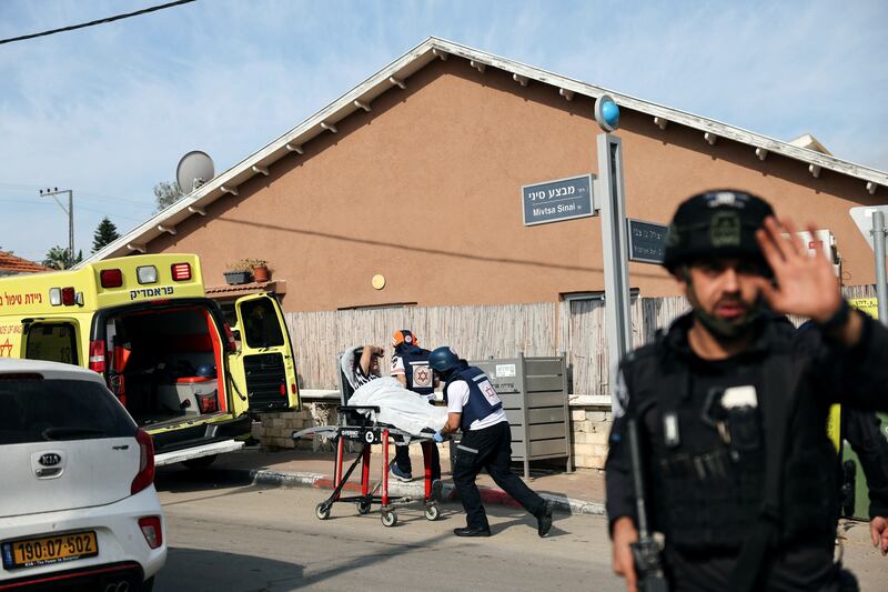 An Israeli woman is evacuated by paramedics following a rocket attack launched from the Gaza Strip into Israel, in Sderot. Reuters