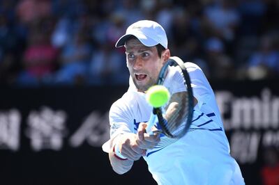 epa07298634 Novak Djokovic of Serbia in action against Denis Shapovalov of Canada during their round three men's singles match at the Australian Open Grand Slam tennis tournament in Melbourne, Australia, 19 January 2019.  EPA/JULIAN SMITH AUSTRALIA AND NEW ZEALAND OUT