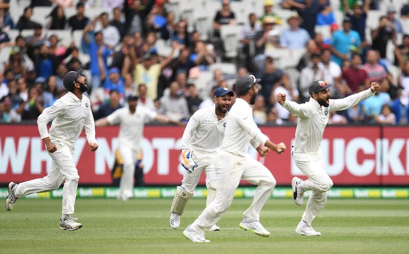 India's Cheteshwar Pujara, Rishabh Pant, Ajinkya Rahane and captain Virat Kohli celebrate after winning the third test match between Australia and India at the MCG in Melbourne, Australia, December 30, 2018. AAP/Julian Smith/via REUTERS  ATTENTION EDITORS - THIS IMAGE WAS PROVIDED BY A THIRD PARTY. NO RESALES. NO ARCHIVE. AUSTRALIA OUT. NEW ZEALAND OUT.