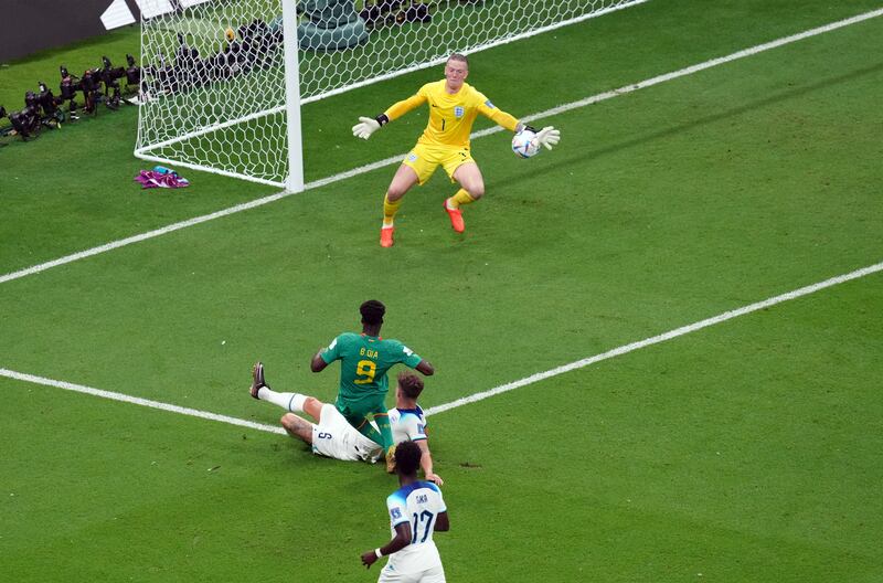 England goalkeeper Jordan Pickford saves from Senegal's Boulaye Dia. PA