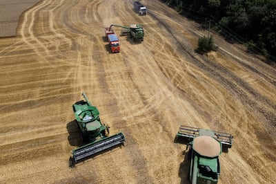 Farmers harvest with their combines in a wheat field near the village Tbilisskaya, Russia, a country that, along with Ukraine, grows much of the world's wheat. AP Photo