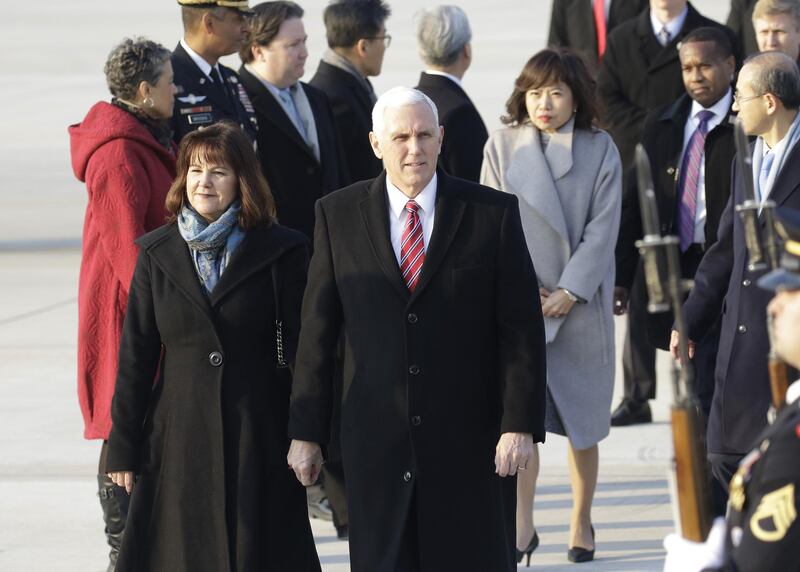 U.S. Vice President Mike Pence and Second Lady Karen Pence arrive at Osan air base in Pyeongtaek, South Korea, on Thursday, Feb. 8, 2018. "The United States will continue to stand shoulder-to-shoulder" with South Korea to pressure North Korea to end its nuclear program, Pence said at meeting in Seoul with South Korea President Moon Jae-in. Photographer: Ryu Seung-il/Pool via Bloomberg