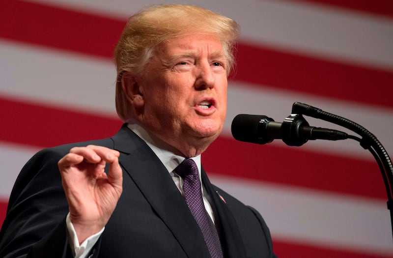 (FILES) This file photo taken on December 18, 2017 shows US President Donald Trump speaking about his administration's National Security Strategy at the Ronald Reagan Building and International Trade Center in Washington, DC.
President Donald Trump launched a fresh attack on his opponents ahead of a new effort in the bitterly divided US Congress to end a budget impasse before hundreds of thousands of federal workers are forced to start the workweek at home without pay. The impact of the shutdown that began at midnight on January 19, 2018 has been largely limited so far, closing sites like New York's Statue of Liberty, but the effect will start to become acute if the stalemate runs into the start of the following week. / AFP PHOTO / SAUL LOEB