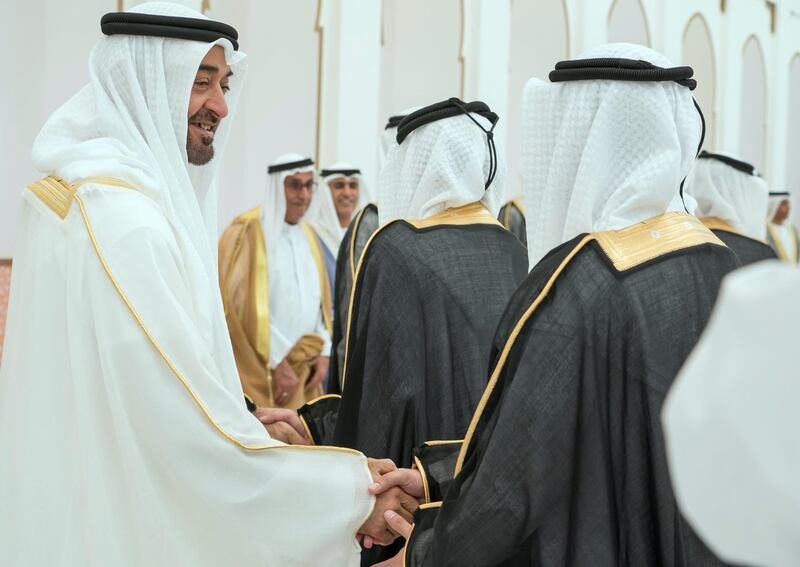ADHAN, RAS AL KHAIMAH, UNITED ARAB EMIRATES - March 13, 2018: HH Sheikh Mohamed bin Zayed Al Nahyan, Crown Prince of Abu Dhabi and Deputy Supreme Commander of the UAE Armed Forces (L), greets a groom who participated in a mass wedding reception for HH Sheikh Mohamed bin Saud bin Saqr Al Qasimi, Crown Prince and Deputy Ruler of Ras Al Khaimah (not shown), at Mohamed bin Zayed, Al Bayt Mitwahid wedding hall. 

( Mohamed Al Hammadi / Crown Prince Court - Abu Dhabi )
---