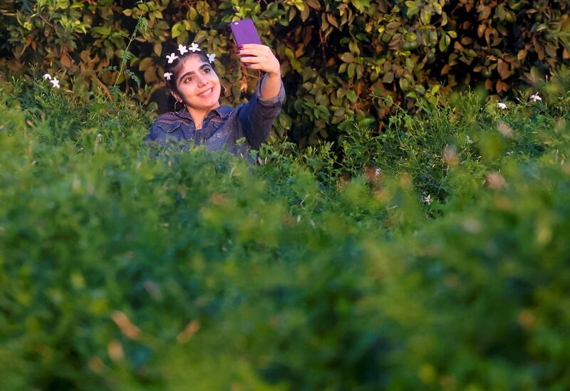 Jasmine flowers adorn the hair of a young woman in Shubra Beloula village in Egypt. All photos: Reuters