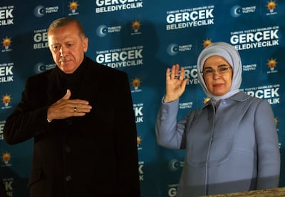 Turkish President Recep Tayyip Erdogan with his wife Emine in Ankara on Sunday after the municipal elections. AFP