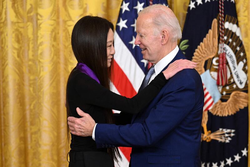 Mr Biden awards fashion designer Ms Wang with the 2021 National Medal of Arts. AFP