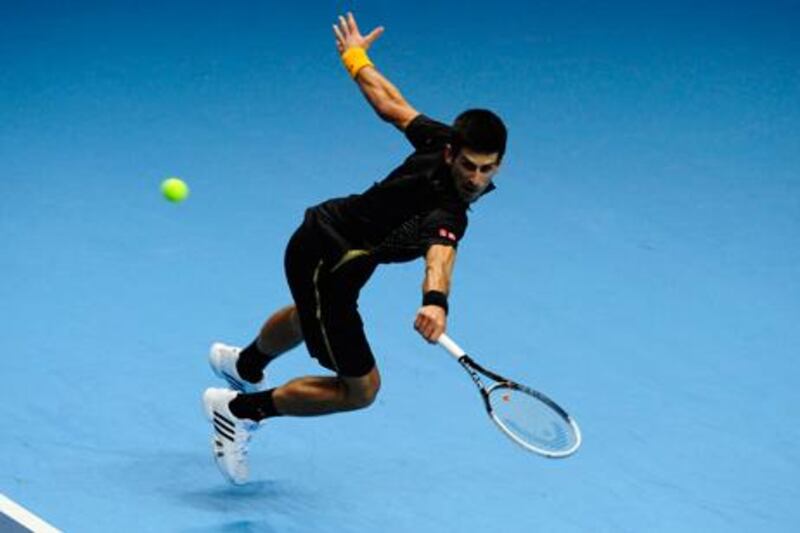 Novak Djokovic returns the ball during his match with Jo-Wilfried Tsonga at the ATP World Tour Finals