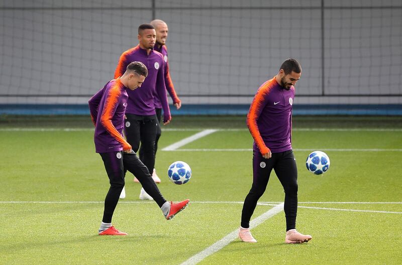 Foden, left, and Ilkay Gundogan attend a training session. PA via AP