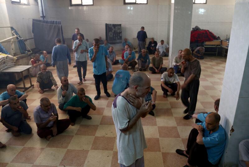 Syrian patients sit and smoke cigarettes in a room at a mental health clinic -- the sole such facility in the rebel-held north of Syria -- in the town of Azaz, near the border with Turkey, on July 6, 2017.
The clinic, which has been relocated twice already from its original location on the northeastern outskirts of Aleppo, serves nearly 140 inpatients as well outsiders who are traumatised with psychological scars from the horrors of Syria's six-year war, including those arrested during the peaceful protests that broke out in 2011, and others who developed anxieties related to the bombing and violence that has killed more than 300,000 people. / AFP PHOTO / Nazeer al-Khatib