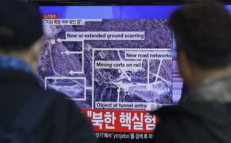 South Koreans watch a TV screen showing a news report about an earthquake near North Korea’s nuclear facility after Pyongyang announced it had tested a hydrogen bomb.  Ahn Young-joon / AP Photo
