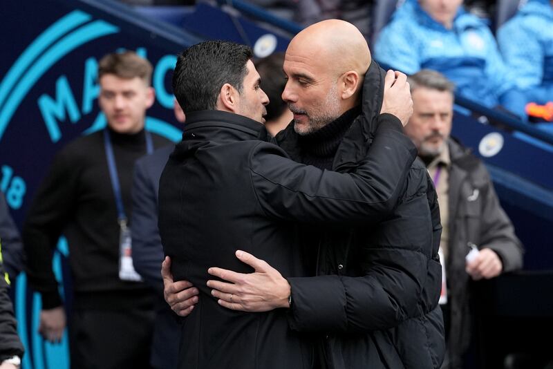Manchester City manager Pep Guardiola with his Arsenal counterpart Mikel Arteta at the Etihad Stadium. PA