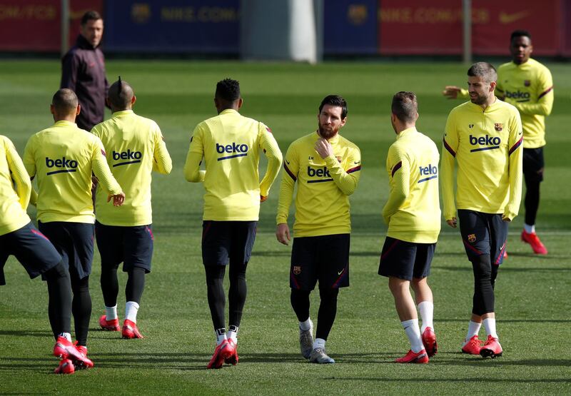 Barcelona's Lionel Messi, Gerard Pique and teammates