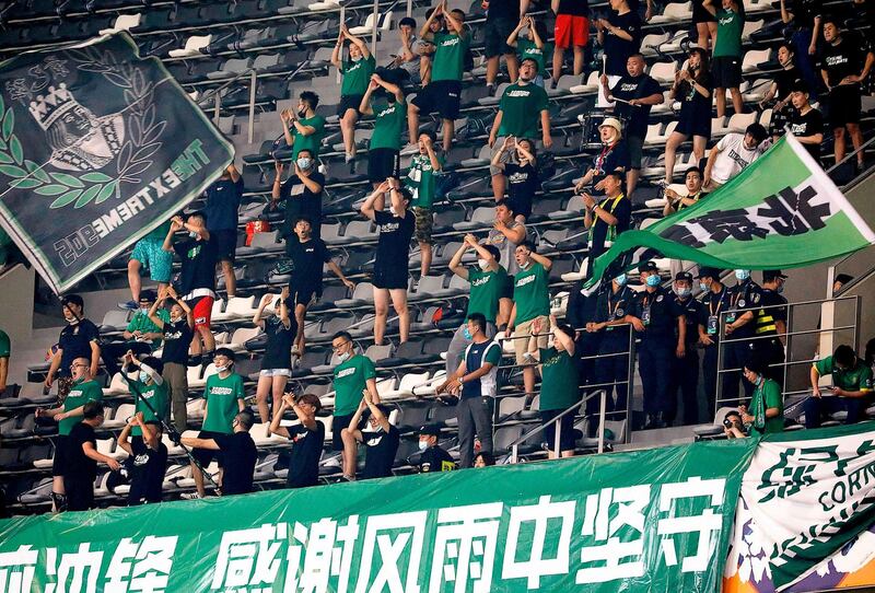 Beijing Guoan fans watch the Chinese Super League match against Shanghai SIPG in Suzhou, in China's eastern Jiangsu province, on Saturday. AFP