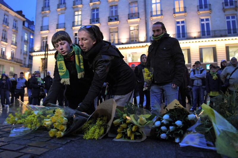 Nantes supporters lay flowers. AFP