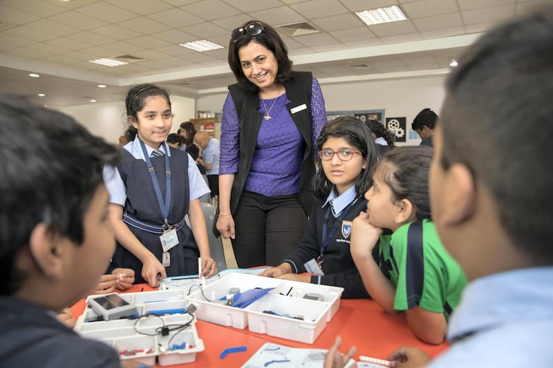 DUBAI, UNITED ARAB EMIRATES. 07 FEBRUARY 2018. KHDA announced the results of the annual inspections of the Indian and Pakistani private schools. Gems Modern Academy is the only Indian curriculum school to have earned an Outstanding rating in the latest round of private schools inspections in Dubai. Principal Nargish Khambatta with year 4 students in the Budhayana Spark Lab. (Photo: Antonie Robertson/The National) Journalist: Roberta Pennington. Section: National.